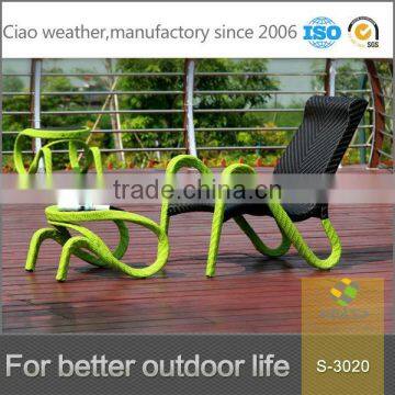 Green rattan wicker beach lounge chair with stool