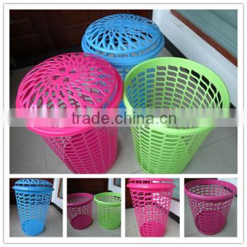 green plastic laundry basket