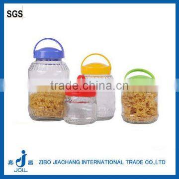 big glass liquid storage bottle with plastic hanging lid