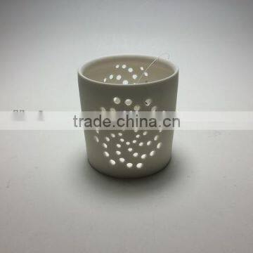 white ceramic hollow out candle cup