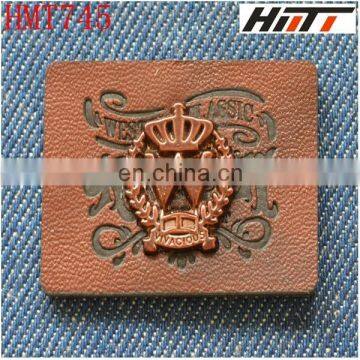 embossed faux leather label with metal patch