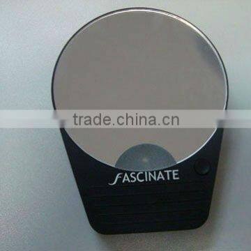 10x magnifying cosmetic mirror with suction cup on the back