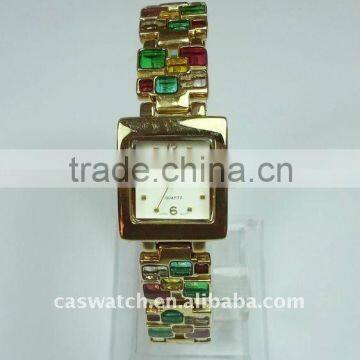 Gold-plated chain watch with plastic bead