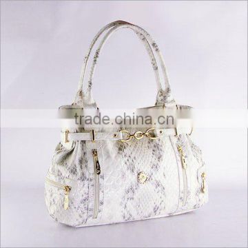 white and black Snake PU handbag