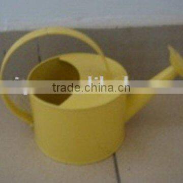 garden yellow metal watering can