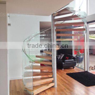 Modern steel wood spiral staircase with frameless glass railings helical staircase