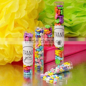 Cylinder shaped clear containers with slip over lids sized to hold gumballs