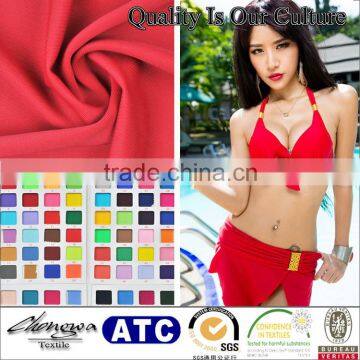 powerful tailoring for swimwear with beautiful cherry red, black, ivory and mustard yellow fabric