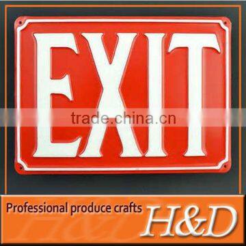 red directional metal exit sign plate