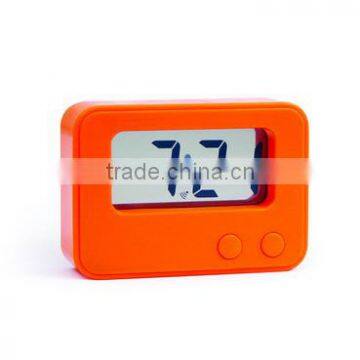 Digital clock with pencil inserted Snooze and alarm