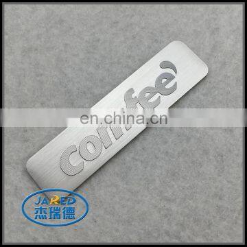 wholesale embossed logo custom brushed metal badges from china