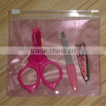 child's travel manicure set packed in a pink PVC bag