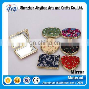 wholesale fashion style fabric frame antiquities silk folding mirror for sale