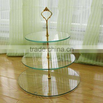 3 tier tempered glass cake display used in the kitchen