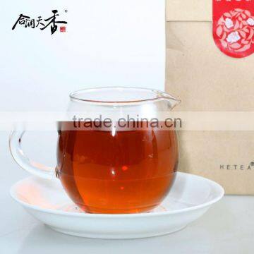 Healthy black tea leaf in craft paper bag