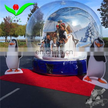 Christmas square inflatable human size snow globe in advertising