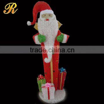 Santa claus with fiber optic christmas decorations gift boxes