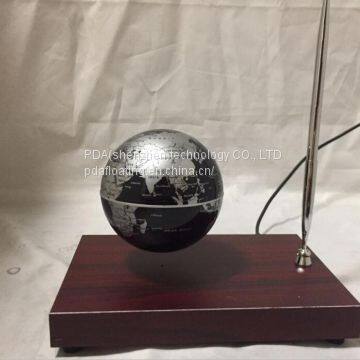 Rectangle red wooden base floating globe with a pen