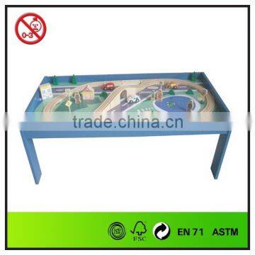 painted wooden playtable with train sets