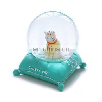 unique fantasy and cute cat sit in the snow globe