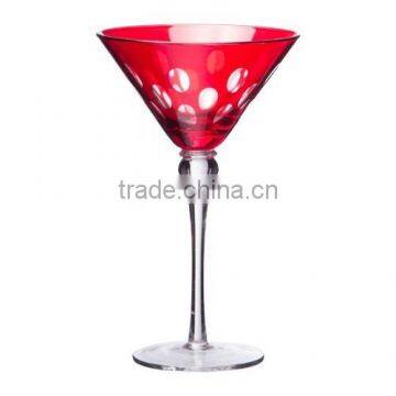 Martini glass with red spraying and hand cutting dots.