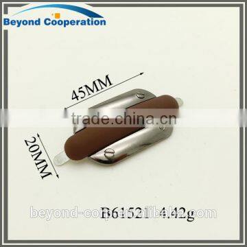 Brown rubber effect plus shiny gun metal plated metal tag accessory for shoes