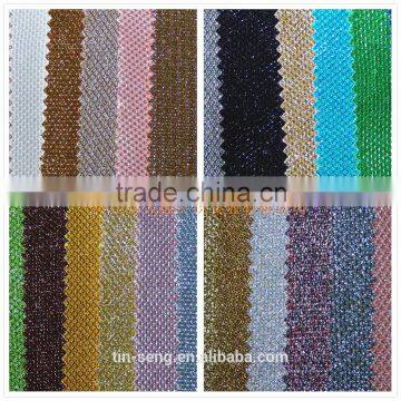 Metallic bonding knit fabric with non-woven base fabric with gold thread