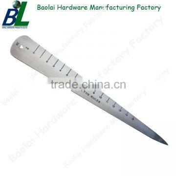 Antique metal letter opener with rule