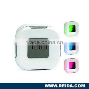 Four sided alarm clockFour sided travel digital clock Each side with different functions of Time