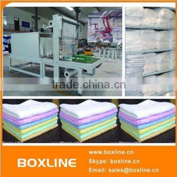 Sleeve bed sheet towel wrap machine