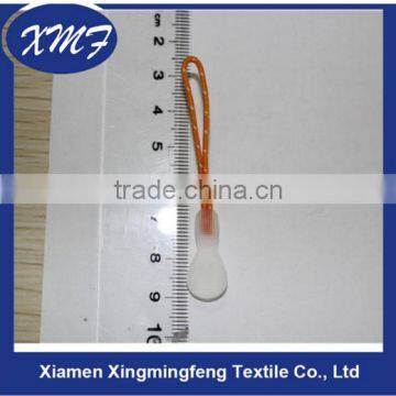 White plastic zipper puller