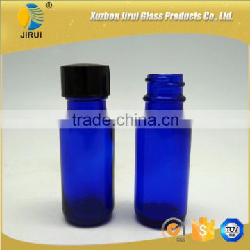 1/2 oz blue glass boston round bottle with black phenolic cap