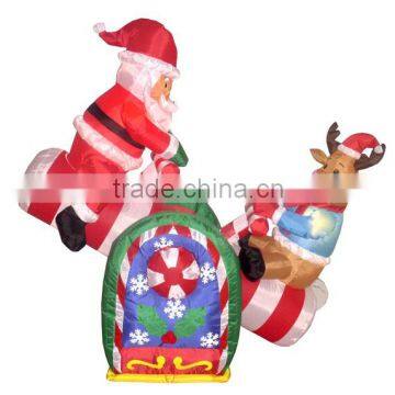 Christmas Decorations Animated Inflatable Santa and Reindeer on a Teeter Totter