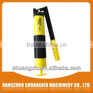 Yellow hand operated grease gun for auto parts