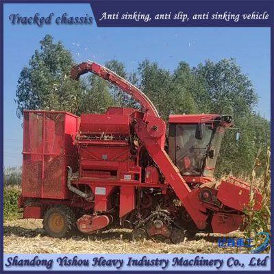 Corn harvester modified with triangular track wheels for anti slip and anti sinking