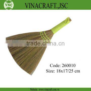 Grass broom with green crochet handle