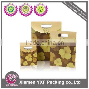 Die cut green handle paper bag with hook and loop