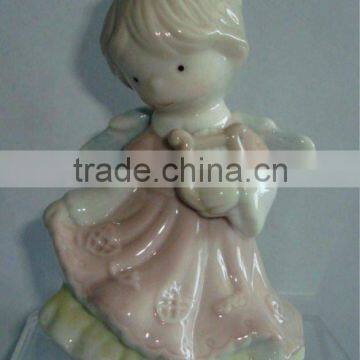 porcelain standing angel with instruments statue