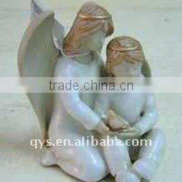 resin sculpture of two angels