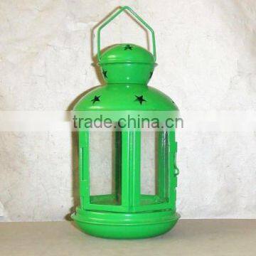 green metal lantern with clear glass wall