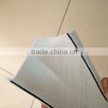 Composite geomembrane with nonwoven geotextile