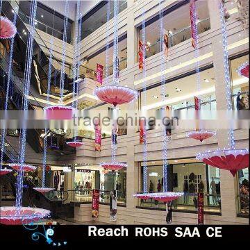 Hanging pink flower umbrella with string light, atrium decoration, indoor decoration