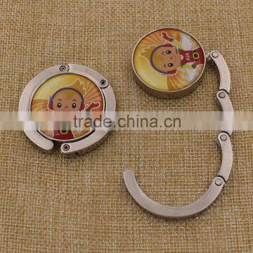 High quality metal zinc alloy purse hanger bag holder with epoxy sticker