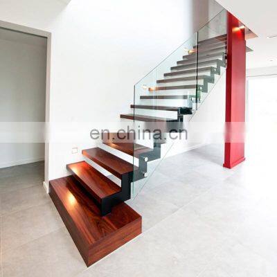 Frameless glass balustrade and zig-zag steel stringer stairs