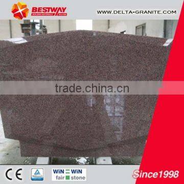 Red granite tombstone