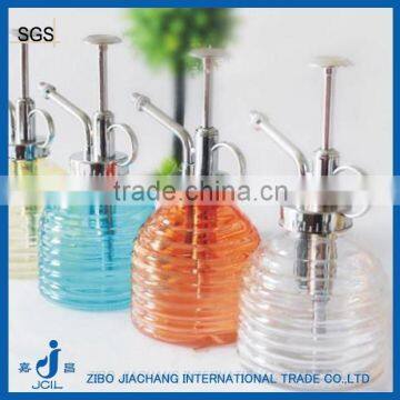 colored round glass water sprayer bottle with pump cap