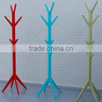 Colorful hanging clothes rack in house