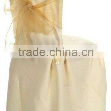 Ivory polyester banquet chair cover with orange sashes for wedding