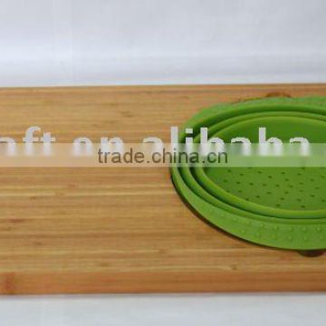 Bamboo cutting board with silicone bowl