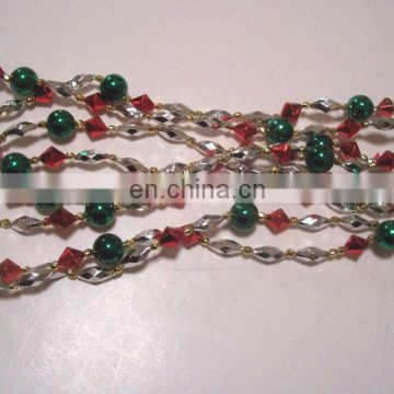 9 FOOT RED, GOLD, SILVER, AND GREEN STRUNG BEAD GARLAND